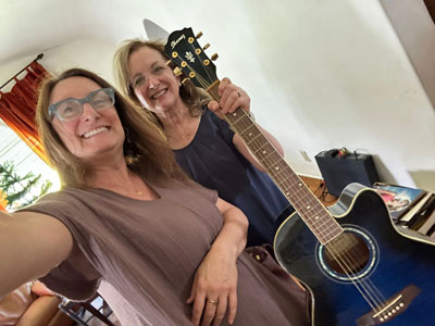 Susan Littenberg receives blue Ibanez from donor Franci-Maharaj-
